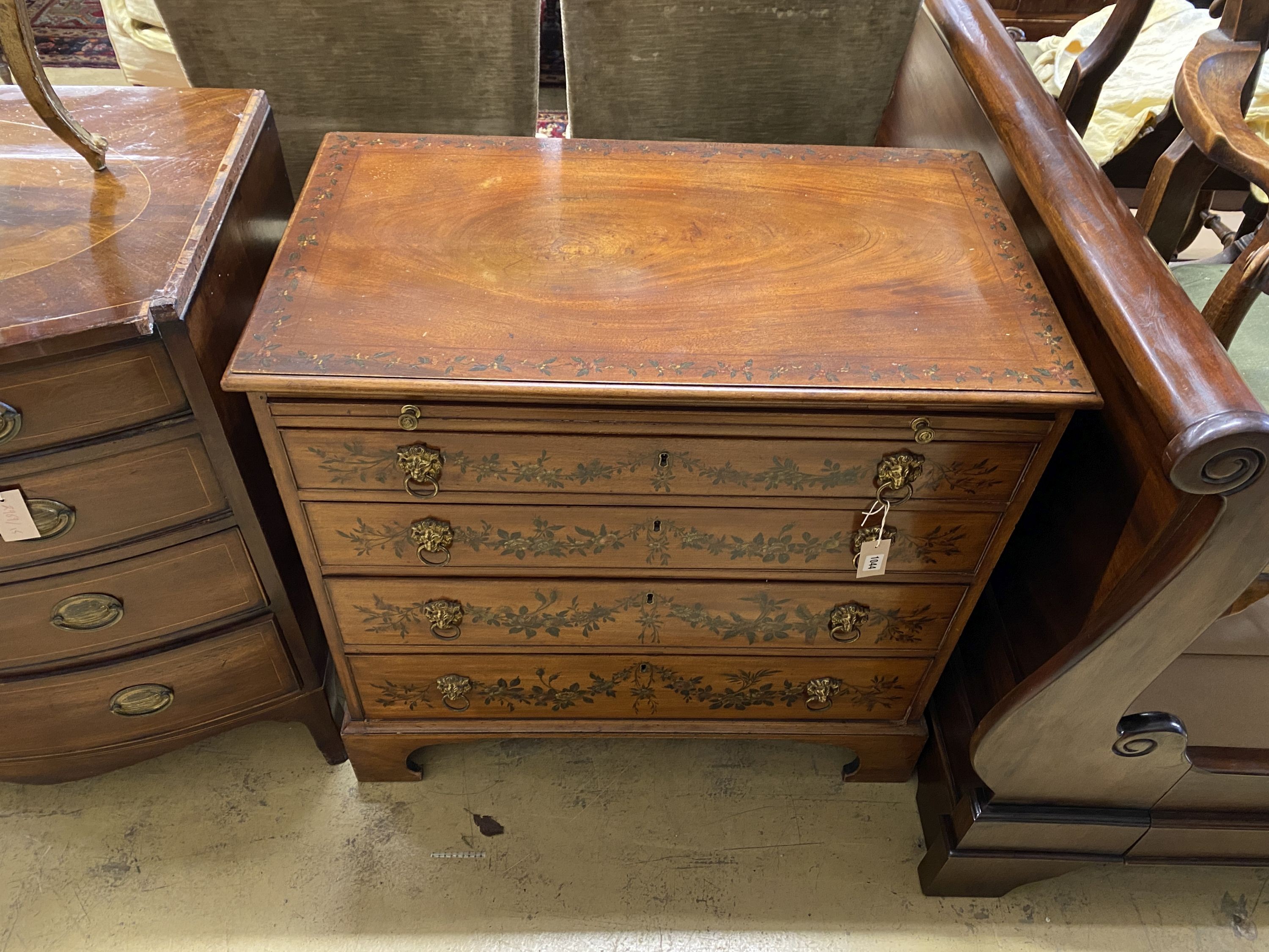 An early 20th century floral painted mahogany chest of drawers, fitted slide, width 90cm, depth 51cm, height 86cm